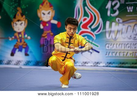 JAKARTA, INDONESIA - NOVEMBER 15, 2015: Hendry Nakata of Brazil performs the movements in the men's Changquan event at the 13th World Wushu Championship 2015 held in Istora Senayan, Jakarta.