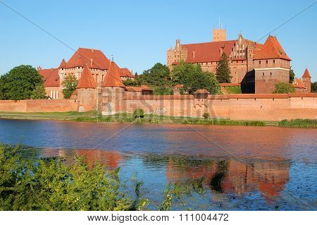 Picturesque scene of Malbork castle on Nogat river in Poland