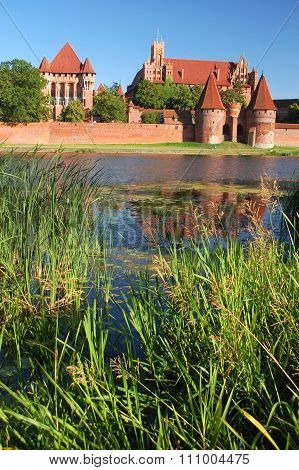 Picturesque scene of Malbork castle on Nogat river in Poland