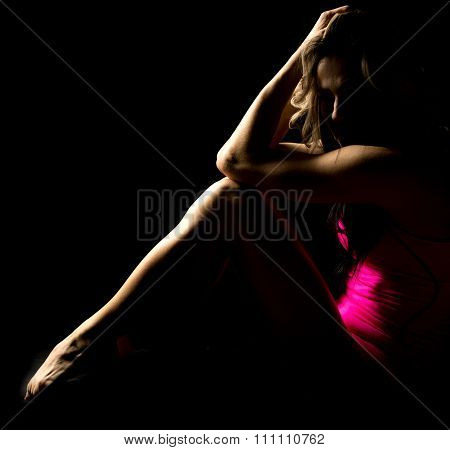 Woman In Pink Shorts And Tank Sit Knees Up Elbows