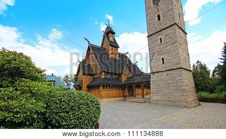 Old wooden Vang stave church with tower of stone in the Karpacz, Karkonosze mountains, Poland