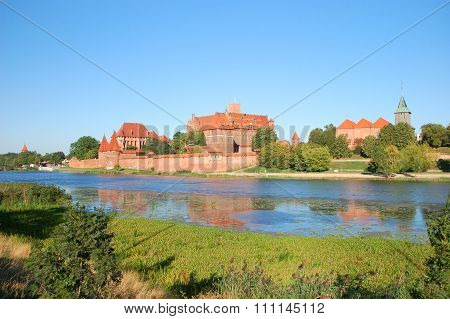 Picturesque scene of Malbork castle on Nogat river in Poland