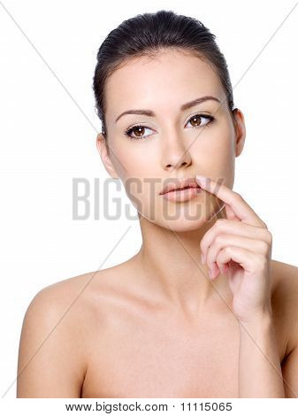 Calm Beautiful Woman Touching Her Lips