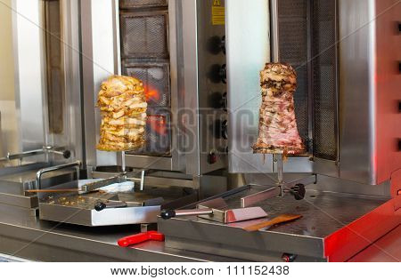 Pita gyros preparation on the kitchen in street cafe.