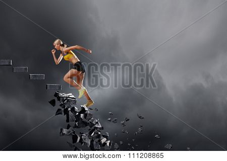 Sports active woman running on stone collapsing ladder