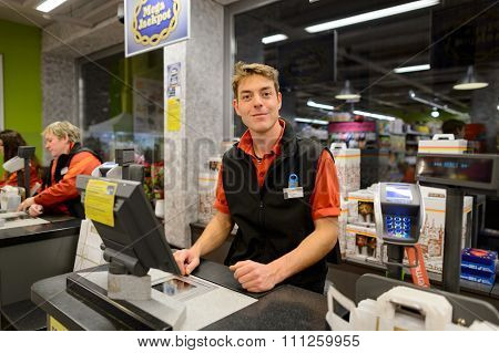 GENEVA, SWITZERLAND - SEPTEMBER 18, 2015: checkout counter in Migros supermarket. Migros is Switzerland's largest retail company, its largest supermarket chain and largest employer
