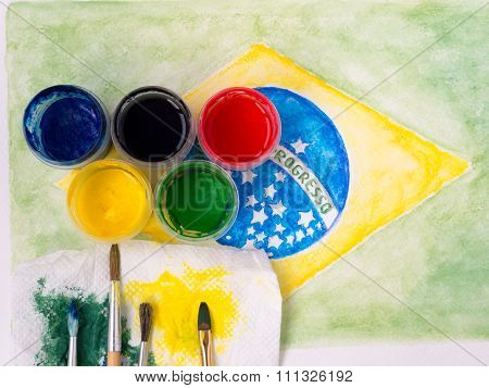 Paints,brushes And And Stained Fabric On The Brazil Flag Watercolor Painting