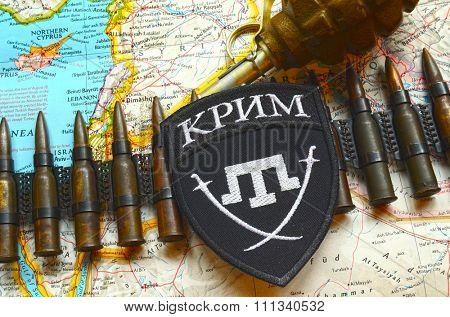 Kiev, Ukraine.NOV 13.Illustrative editorial. Chevron of Islamic extremist formation Crimea as part of Ukrainian Army.Background map November 13, 2015 in Kiev, Ukraine