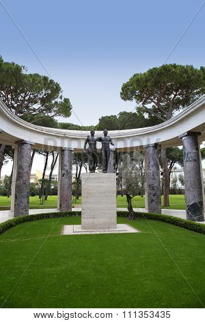 Nettuno - April 06: Bronze Statue Of Two Brothers In Arms Of The American Military Cemetery Of Nettu