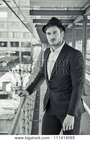 Man Wearing Hat and Looking Out Window