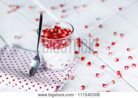 Delicious Dessert Pannacotta With Fresh Pomegranate Seeds In A G