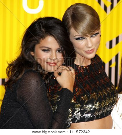 LOS ANGELES, CA - AUGUST 30, 2015: Selena Gomez and Taylor Swift at the 2015 MTV Video Music Awards held at the Microsoft Theater in Los Angeles, USA on August 30, 2015.
