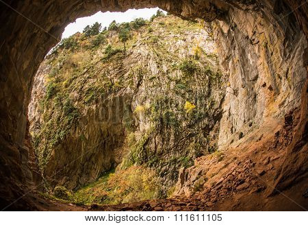 Scenic Mountain Autumn Landscape With A Cave
