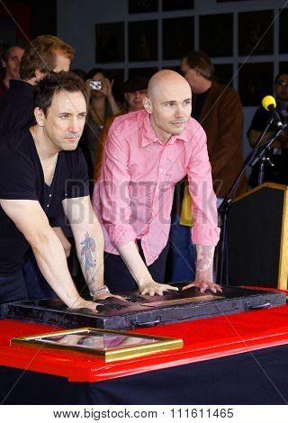 HOLLYWOOD, CALIFORNIA. April 23, 2008. Billy Corgan and Jimmy Chamberlin attend the Hollywood's RockWalk inducts The Smashing Pumpkins held at the Guitar Center in Hollywood, California United States.