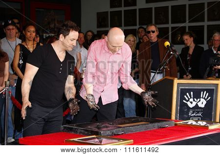 HOLLYWOOD, CALIFORNIA. April 23, 2008. Billy Corgan and Jimmy Chamberlin attend the Hollywood's RockWalk inducts The Smashing Pumpkins held at the Guitar Center in Hollywood, California United States.