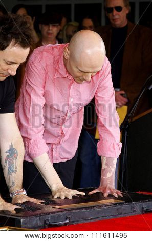 HOLLYWOOD, CALIFORNIA. April 23, 2008. Billy Corgan and Jimmy Chamberlin attend the Hollywood's RockWalk inducts The Smashing Pumpkins held at the Guitar Center in Hollywood, California United States.