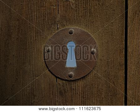 Rusted Keyhole Of An Aged Wooden Door