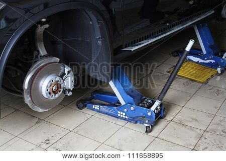 Car Repairs Service. The Car On Jacks