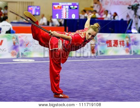 JAKARTA, INDONESIA - NOVEMBER 17, 2015: Marina Faure of France performs the movements in the women's Jianshu event at the 13th World Wushu Championship 2015 in Istora Senayan Stadium.