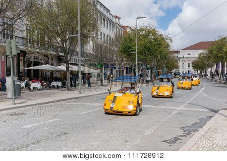 Lisbon, Portugal March 24, 2013: Tourists exploring Lisbon on rented GoCar. The GoCars were created with the purpose of being rented to tourists as a different way to see a city
