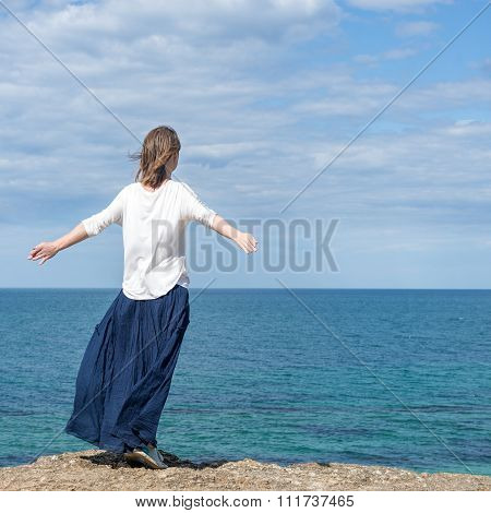 Woman standing at the beach