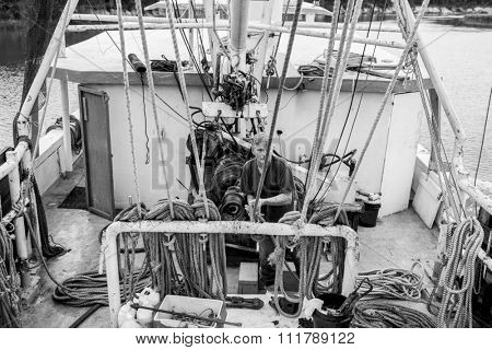 BEAUFORT, SOUTH CAROLINA-OCTOBER 16, 2015: Unidentified worker hauls a net on a fishing vessel off the coast of Beaufort, South Carolina