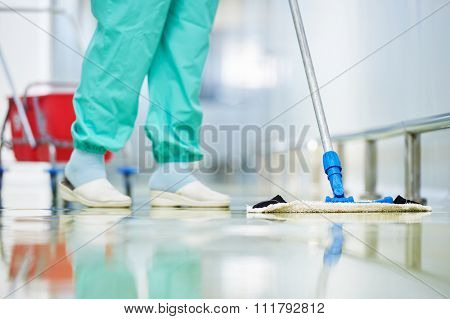 Floor care and cleaning services with washing mop in sterile factory or clean hospital 