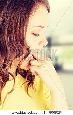 Woman putting her finger in mouth to provoke vomiting