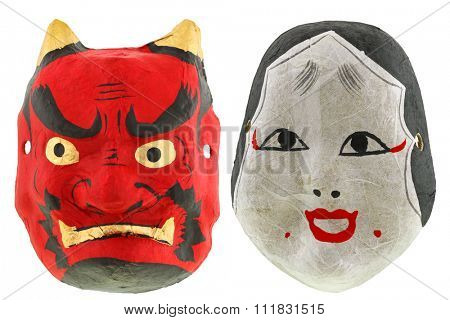Traditional Japanese theater masks Red devil mask Oni (Demon) and okame otafuku mask, isolated on white