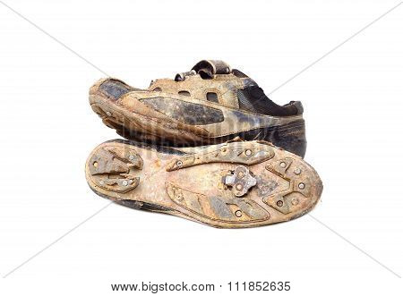 Old and dirty cycling shoes isolated on white background