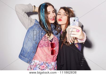 Two Beautiful Brunette Women (girls) Teenagers Spend Time Together Having Fun, Make Funny Faces, Mak