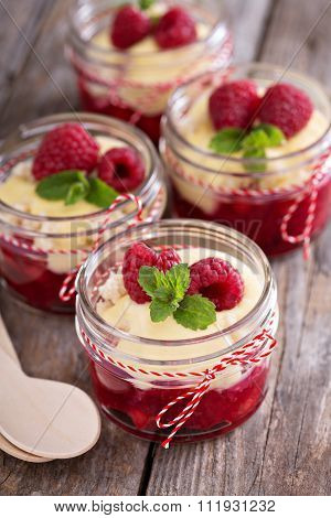 Colorful and delisious dessert in a jar berry cramble