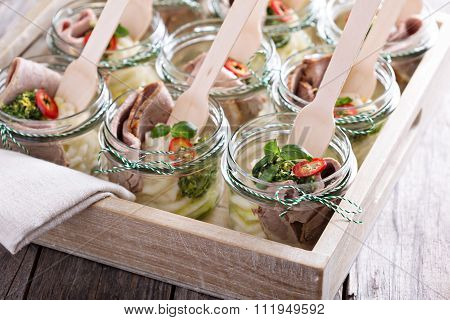 Roastbeef with mashed potatoes in small jars