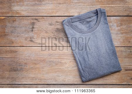 Top View Of Color T-shirt On Grey Wood Plank