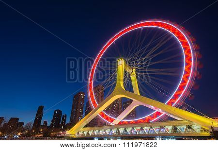 Night Scene Cityscape Of Tianjin Ferris Wheel,tianjin Eye With Dark Blue Background. Tianjin Eye Is