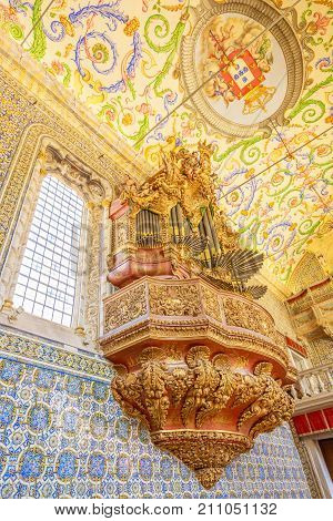 Coimbra, Portugal - August 14, 2017: details of pipe organ inside of Capela de Sao Miguel, the Chapel of University of Coimbra, a tourist attraction of university in upper Coimbra, Central Portugal.