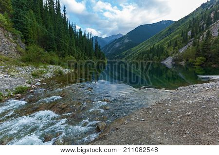Beautiful view of high mountain lake Kolsai in Kazakhstan, central Asia