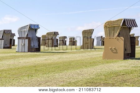 coastal scenery with lots of beach chairs around Buesum in Dithmarschen at Schleswig-Holstein Germany