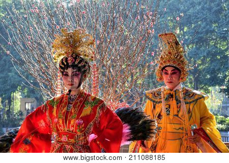 CANTON, CHINA - CIRCA JANUARY 2017: The two singers of Cantonese opera performer in the park.