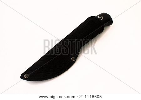 Knife with a black wooden handle in black cloth scabbard with rivets on a white background.