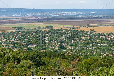 View from the height of the plateau to the village of Madara. Bulgaria.