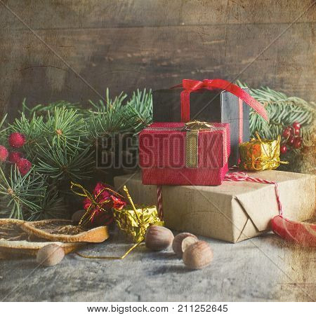 Red Christmas  Gift  Box With Red Ribbon And Fir Branches