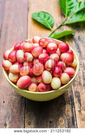 Karanda In A Bowl On Wooden Background With Copy Space