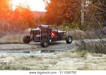 Buggy Car In The Sunlight. Driver With The Second Assistants In The Car Buggy Ride. Riding  Buggy