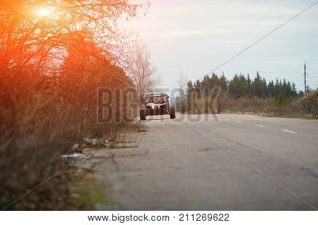 Buggy Car In The Sunlight. Driver With The Second Assistants In The Car Buggy Ride. Riding  Buggy