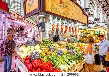 VALENCIA, SPAIN - August 19, 2017: Store with food at the central market located in across from the Llotja de la Seda and the church of the Juanes in Valencia city