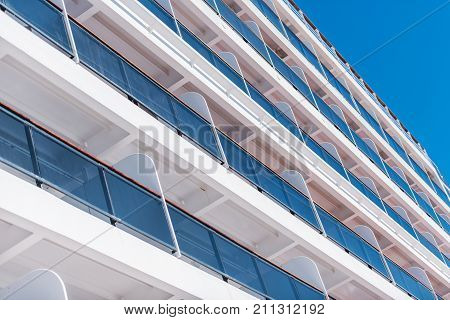 Cruise Ship Stateroom Balconies Closeup. Vessel Sea Travel Theme.