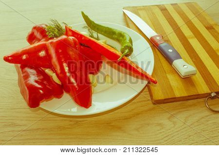 Red bell pepper backgro and Green Peppers. Fresh organic vegetables on table. Green and red bell pepper backgro. Fresh raw vegetables on the table - Retro color