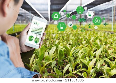 Agriculture Technology Concept Man Agronomist Using A Tablet Internet Of Things  Report