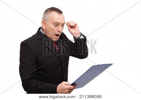 Shocked businessman reading a document